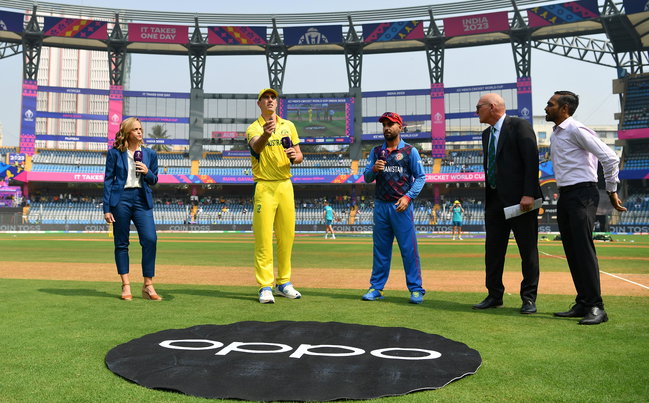Hashmatullah Shahidi with Australia captain Pat Cummins