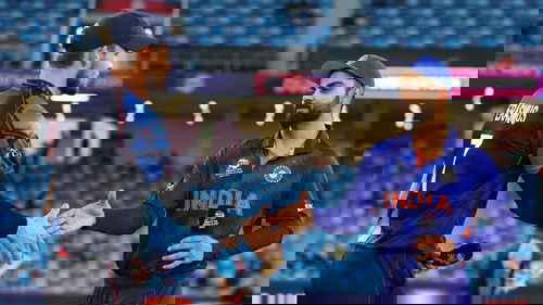 Gerhard Erasmus and Virat Kohli greet each other at the toss