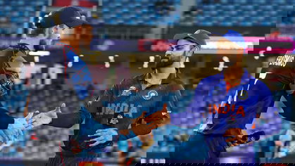 Gerhard Erasmus and Virat Kohli greet each other at the toss