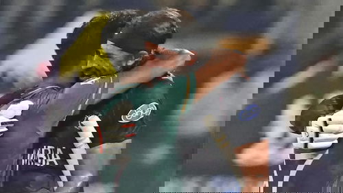 Haris Rauf and David Wiese hug each other after the game