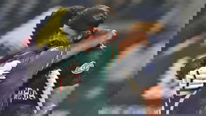 Haris Rauf and David Wiese hug each other after the game