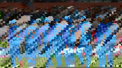 India huddle ahead of the match