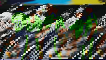 Josh Little celebrates with team mates the wicket of Glen Maxwell