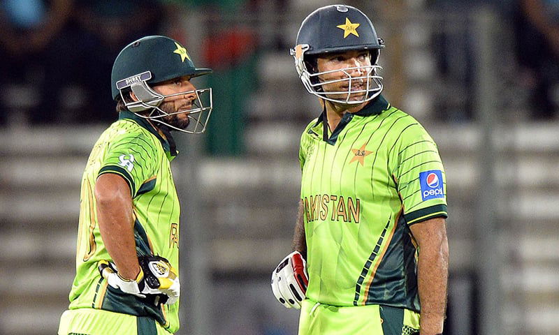 Pakistan batsmen Shahid Afridi (L) and Sohaib Maqsood look on during a one-day international 2015 World Cup. (Photo- AFP)