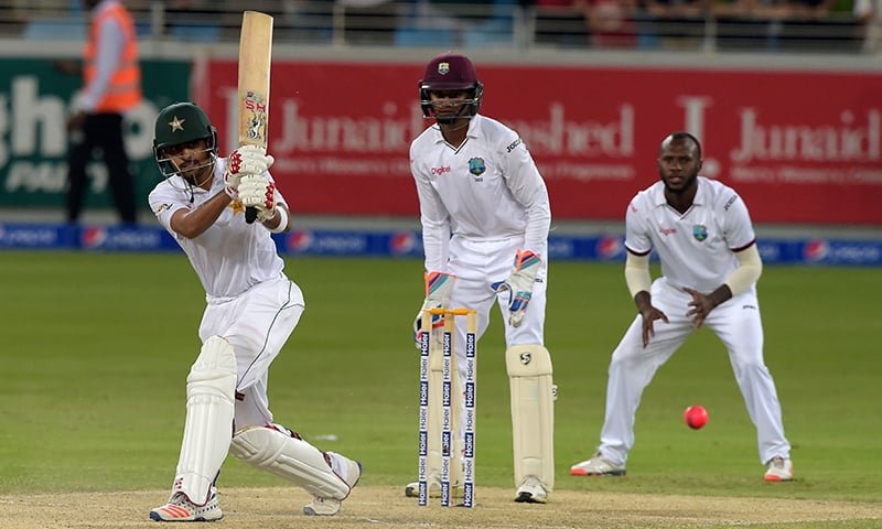  Pakistani batsman Babar Azam (L) plays a shot AFP PHOTO / AAMIR QURESHI