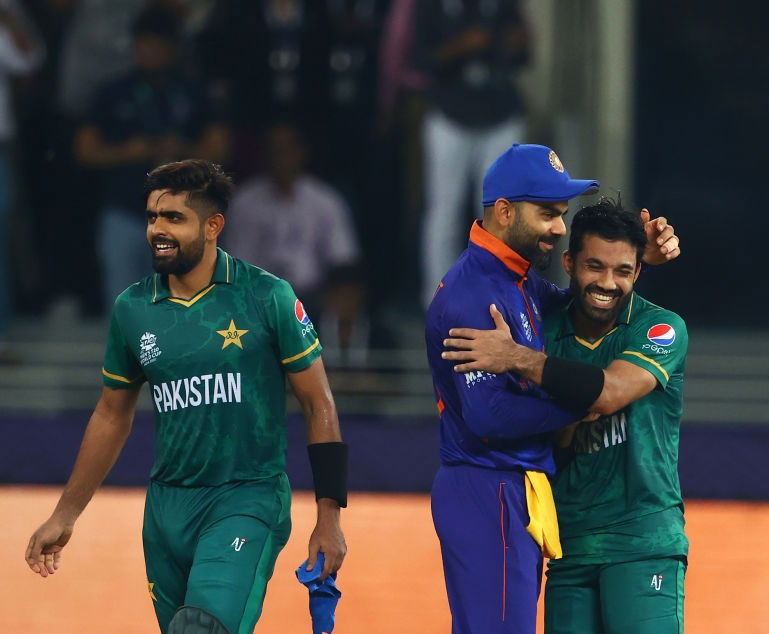 DUBAI, UNITED ARAB EMIRATES - OCTOBER 24: Mohammad Rizwan and Babar Azam of Pakistan interact with Virat Kohli of India following the ICC Men's T20 World Cup match between India and Pakistan at Dubai International Stadium on October 24, 2021 in Dubai, United Arab Emirates. (Photo by Francois Nel/Getty Images)