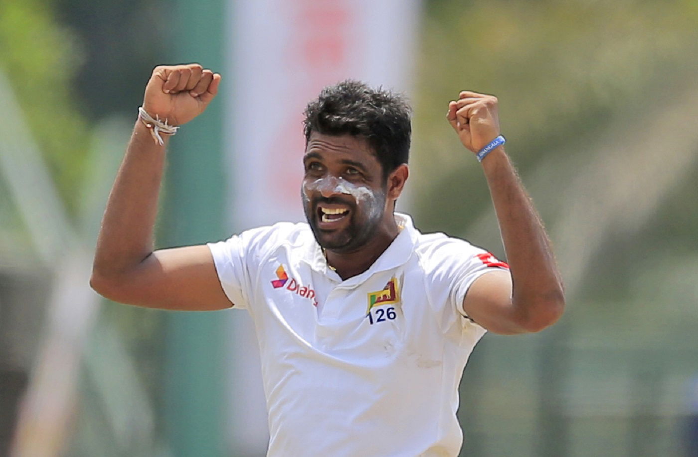 Sri Lanka's Dilruwan Perera celebrates taking the wicket of South Africa's Faf du Plessis during the second day of their second test cricket match in Colombo, Sri Lanka, Saturday, July 21, 2018. (AP Photo/Eranga Jayawardena)