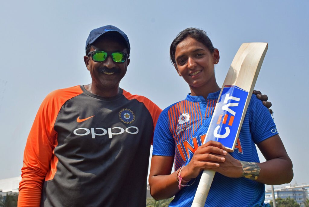 Biju George with Harmanpreet Kaur. Photo- Cricinfo