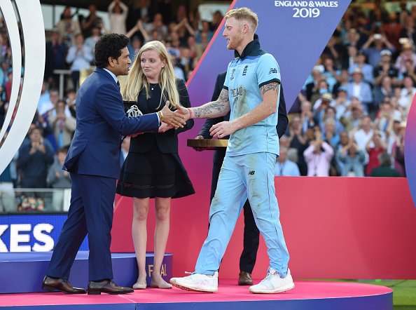 LONDON, ENGLAND - JULY 14: Ben Stokes of England is presented with his man of the match award by Sachin Tendulkar after winning the Final of the ICC Cricket World Cup 2019 between New Zealand and England at Lord's Cricket Ground on July 14, 2019 in London, England. (Photo by Gareth Copley-ICC/ICC via Getty Images)