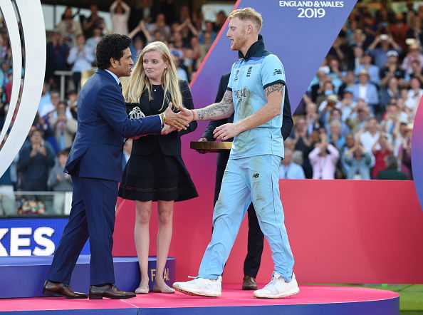 LONDON, ENGLAND - JULY 14: Ben Stokes of England is presented with his man of the match award by Sachin Tendulkar after winning the Final of the ICC Cricket World Cup 2019 between New Zealand and England at Lord's Cricket Ground on July 14, 2019 in London, England. (Photo by Gareth Copley-ICC/ICC via Getty Images)