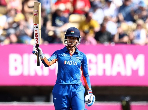 India's Smriti Mandhana acknowledges her fifty runs during the women's Twenty20 Cricket semi-final match between India and England on day nine of the Commonwealth Games at Edgbaston in Birmingham, central England, on August 6, 2022. (Photo by Darren Staples / AFP) (Photo by DARREN STAPLES/AFP via Getty Images)