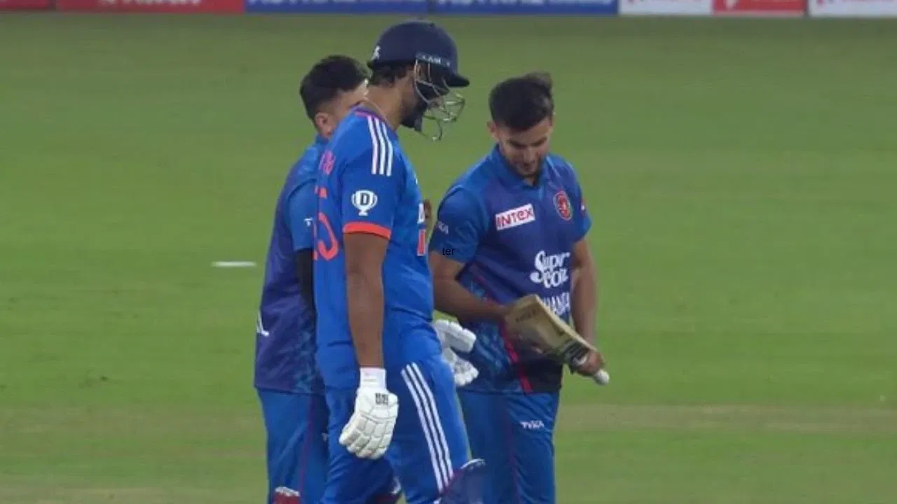 Afghanistan players check Shivam Dubes bat