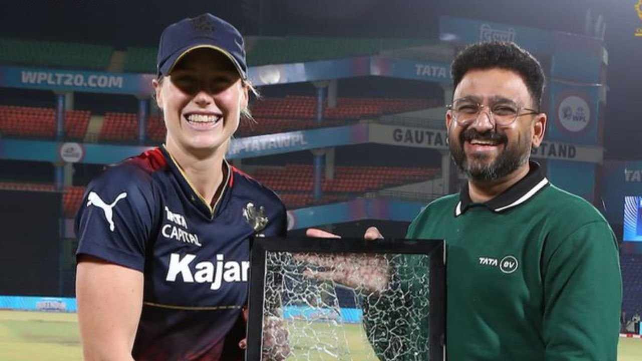Ellyse Perry and receives special award from TATA official