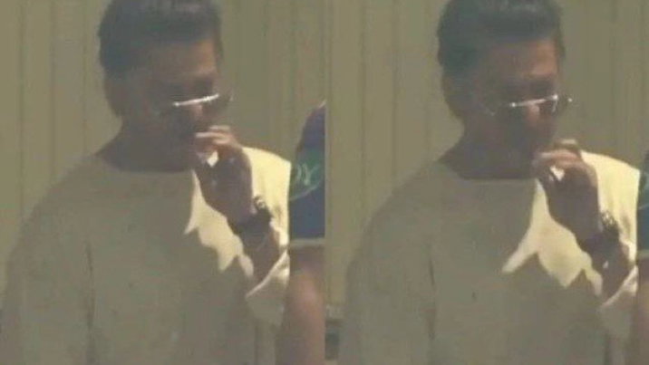 Shah Rukh Khan smoking during IPL match